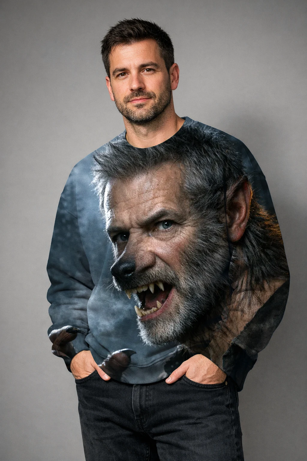 A man in a crewneck sweatshirt printed edge to edge with the Werewolf render, hands in his pockets, studio light
